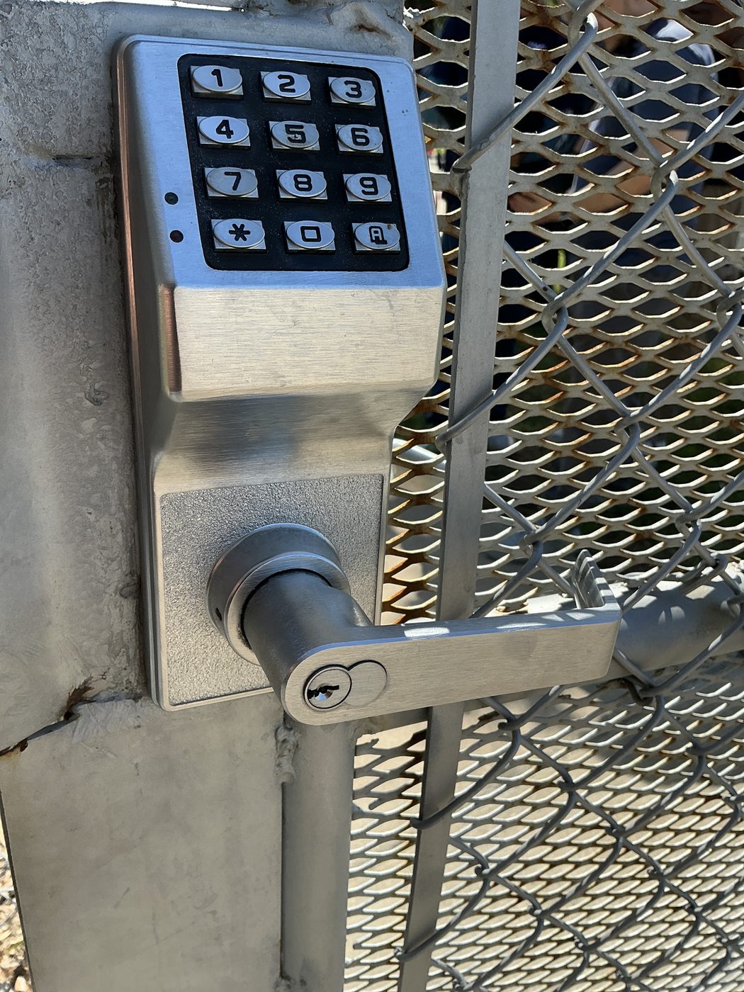 Standalone access control keypad entry mounted on a chain-link security gate