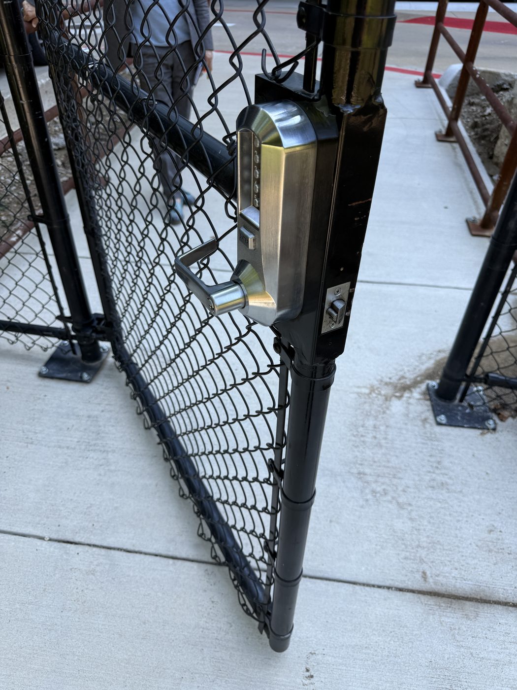 Standalone access control keypad entry mounted on a chain-link security gate