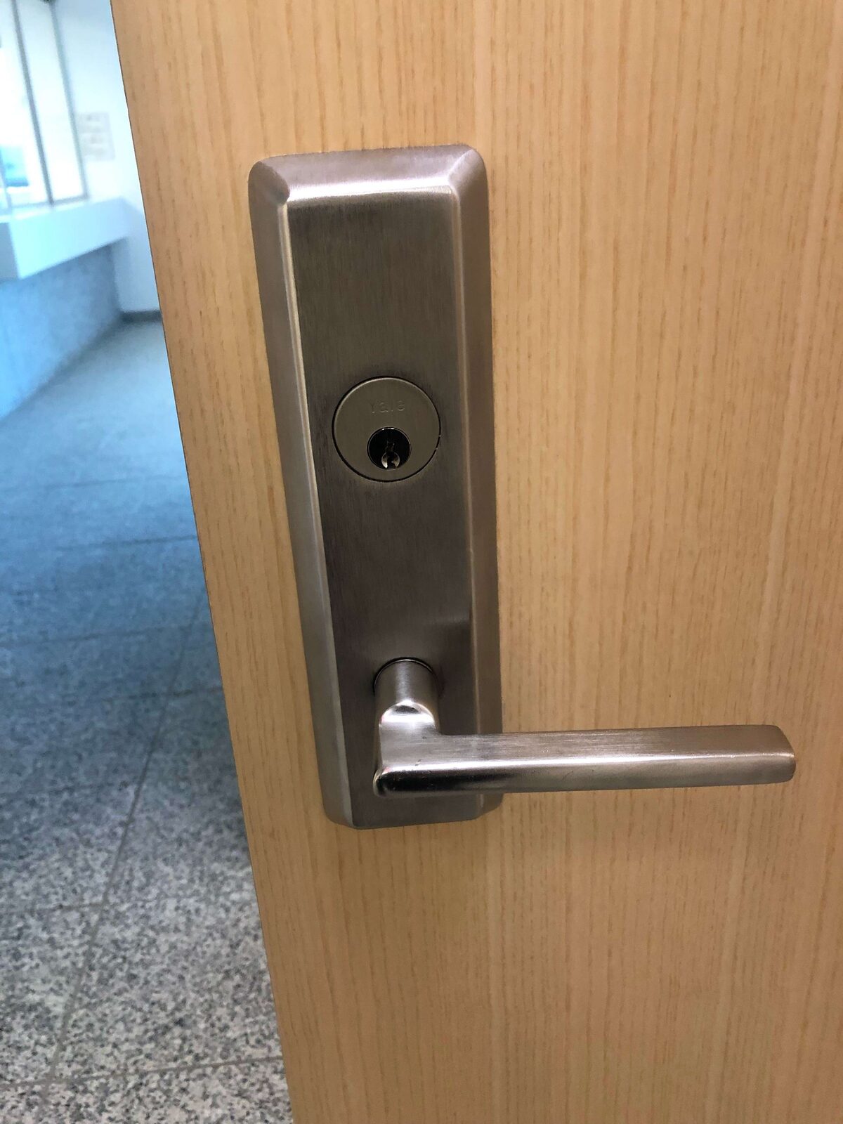 Keyed lever handleset installed on an interior office door