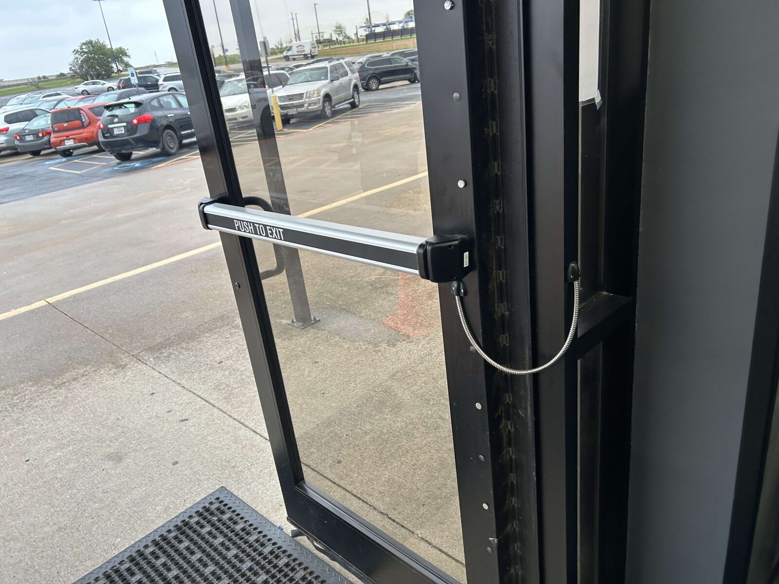 Panic exit bar installed on a glass storefront door
